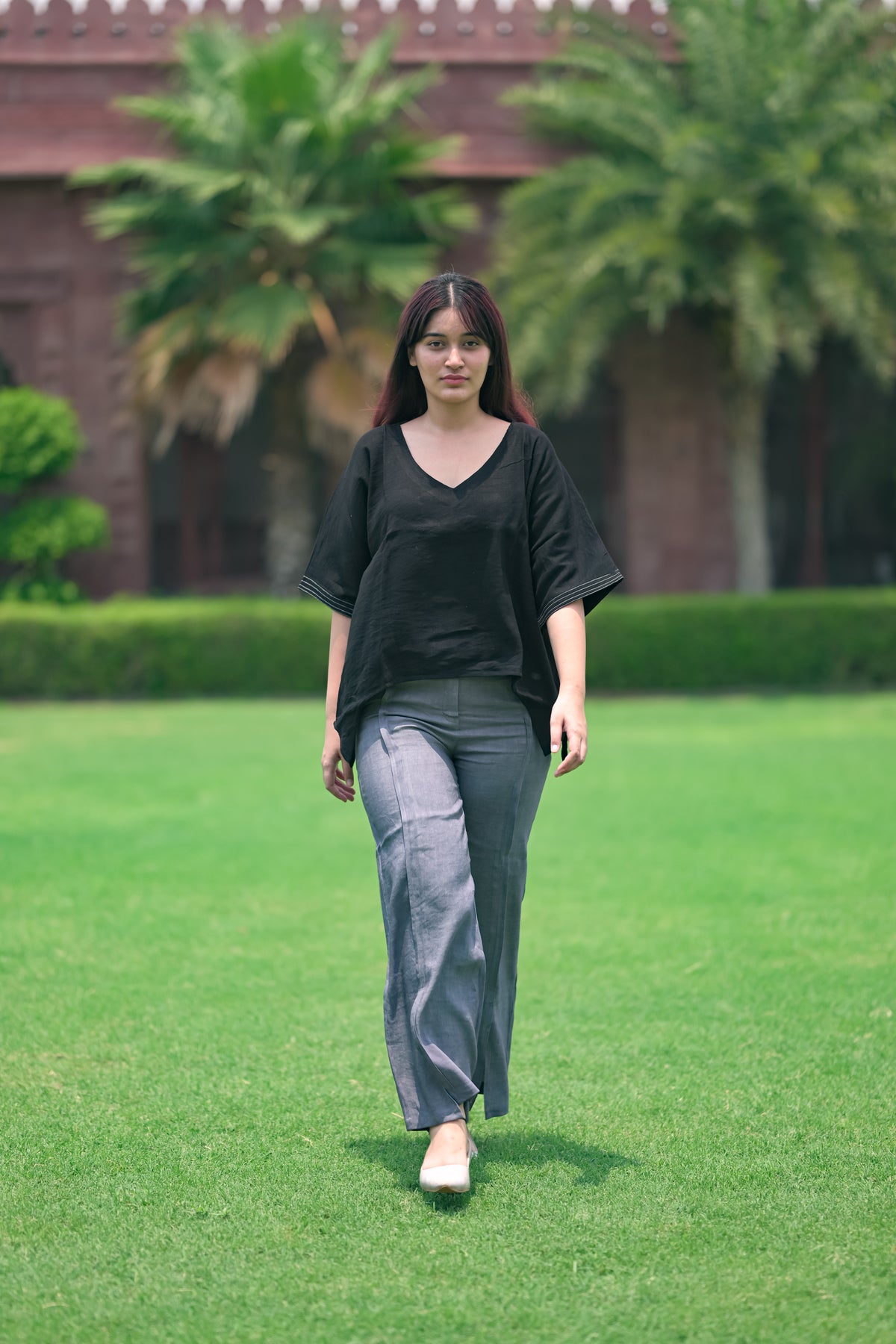 Asymmetrical Hem Poncho Top / High-Waisted Wide-Leg Pants with Side Slits